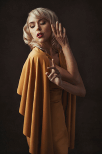 Low Key fashion portrait with elegant yellow wardrobe