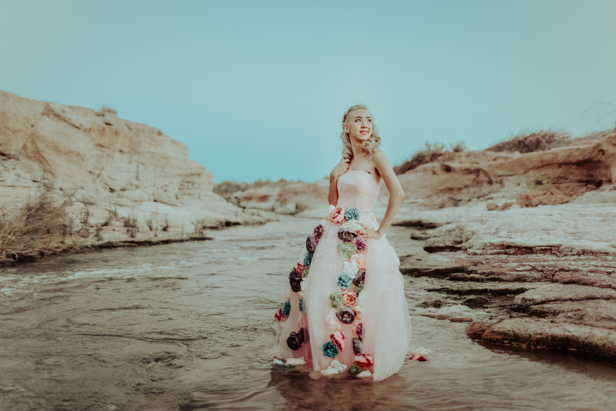 Couture styled floral dress fashion photography in Las Vegas standing in river at sunset