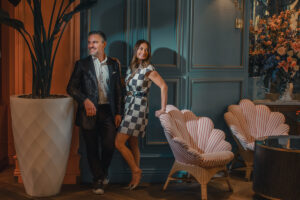 Stunning couples anniversary photography portrait in Las Vegas at the Bellagio, fit for a magazine spread all dressed in Louis Vuitton suit, dress and shoes