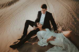 Beautiful and elegant engagement pictures celebrating a couples love in the sand dunes outside of Las vegas.
