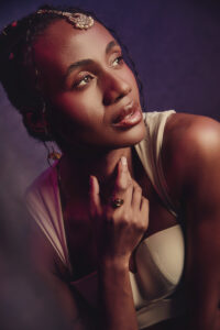 Close up beauty fashion portrait of professional hair and makeup with elegant jewelery