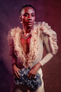 African American woman dressed in couture fashion styled outfit with ruffles