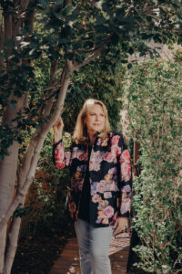 Mature and elegant lifestyle editorial portrait of woman in her garden in Las Vegas
