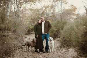 Warm family portrait with family dogs out in the Red Rock Canyon area in Las Veags