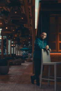 Editorial portraits in teal jacket at Area 15 in Las Vegas