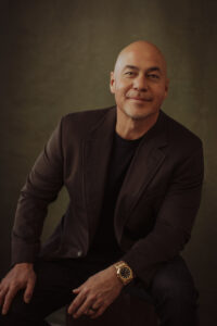 Strong male modern headshot with emotion and rich color.