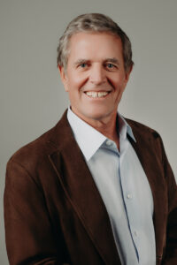 Strong CEO entrepreneur headshot with personality and professional lighting