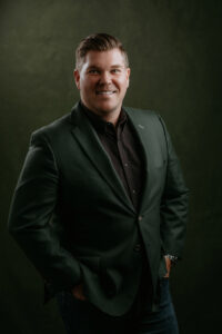 Dapper and modern mens headshot with green suit jacket